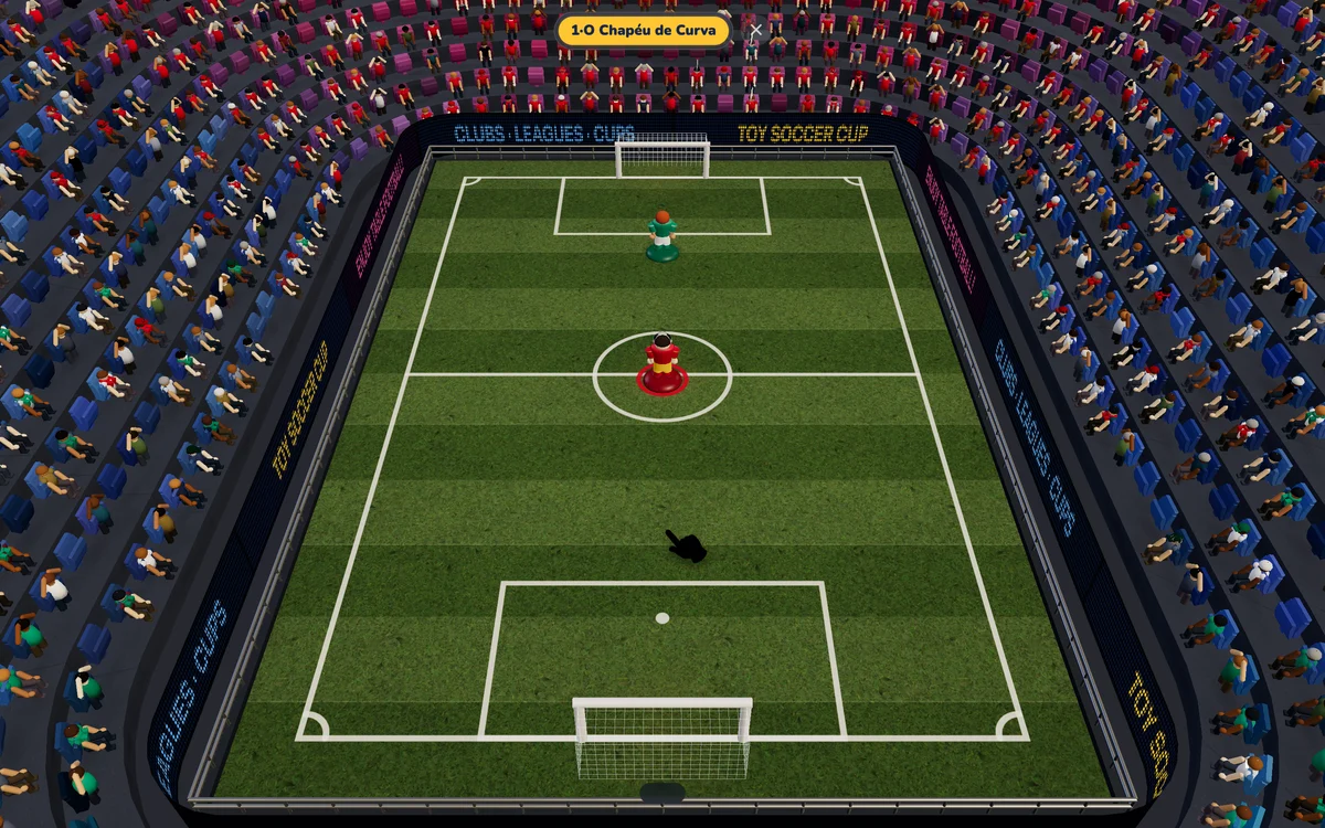 Escola de Truques do Toy Soccer Cup, exercício 1: O Chapéu de Curva, com a mão mostrando o gesto