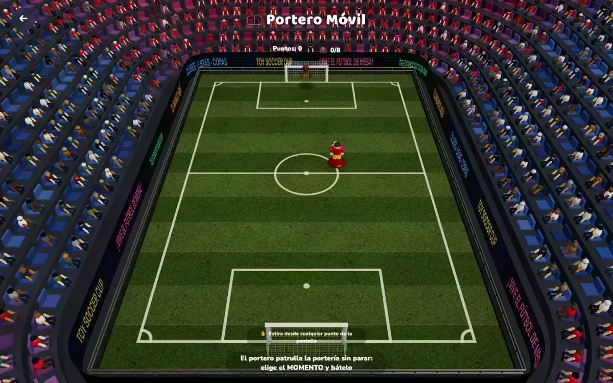 A goalkeeper piece covering the goal on a tabletop pitch